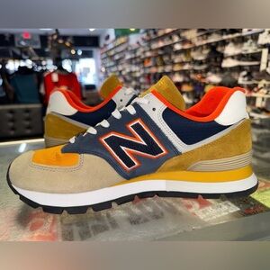 Size 10 - New Balance 574 Rugged Brown Navy